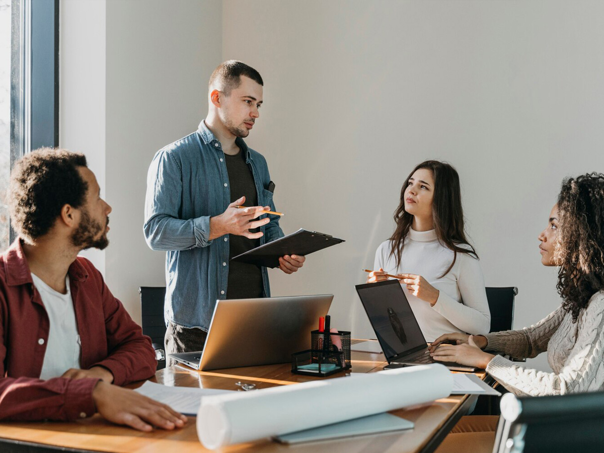 Business team in a boardroom reviewing a presentation